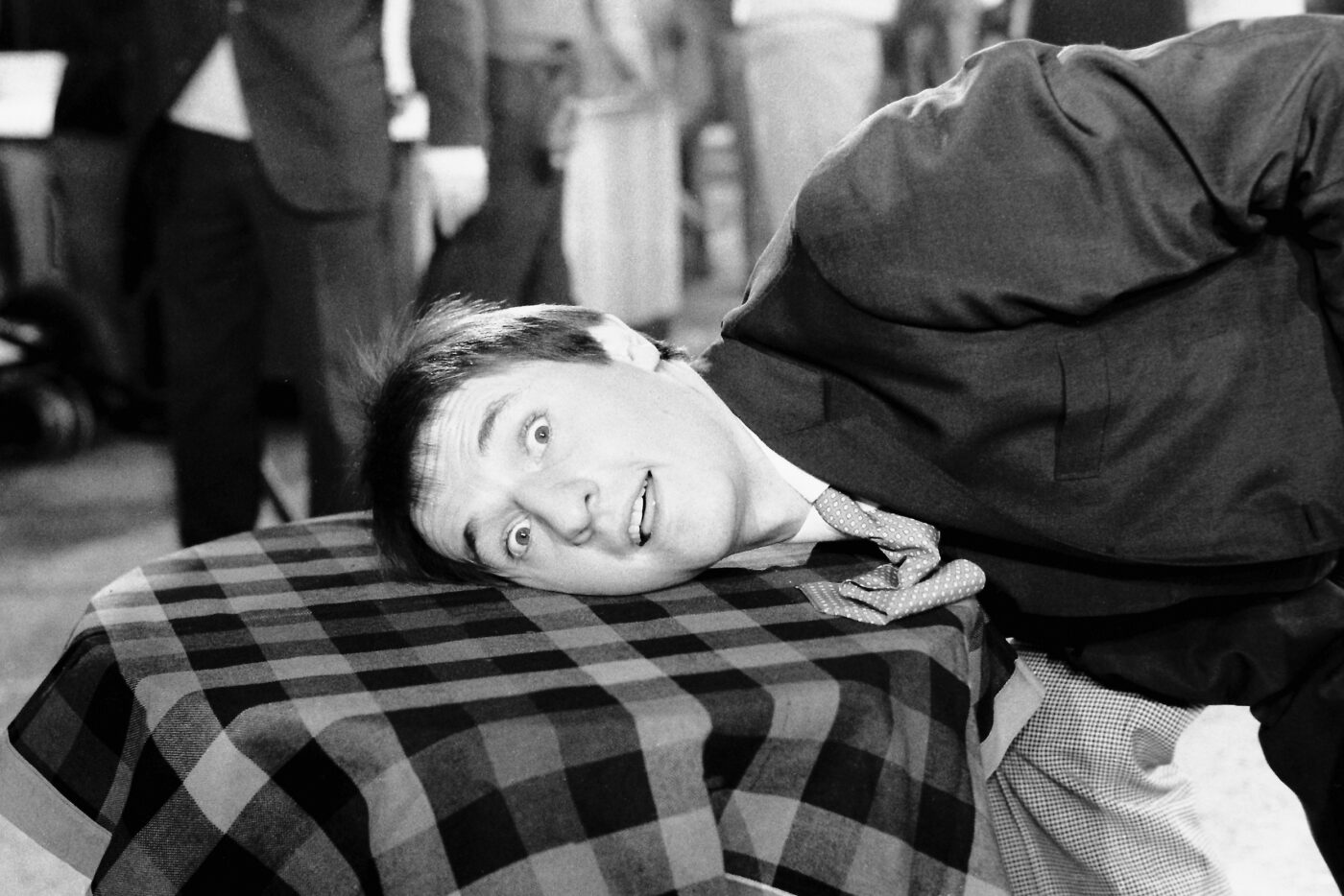 Photographic Social Vision - Micky (Miguel Ángel Carreño) cantante de Los Tonys, bromea en el set de rodaje de “Codo a codo”. Madrid, 1965